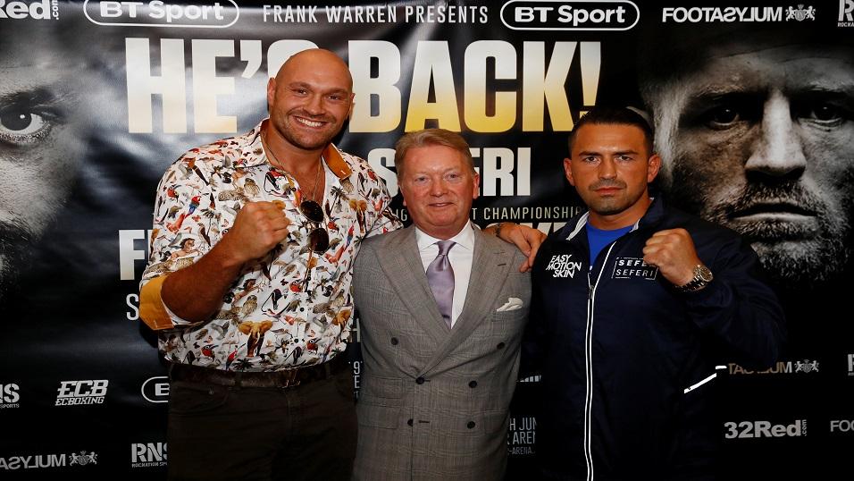 Tyson Fury (left) poses with Sefer Seferi (right) and promoter Frank Warren
